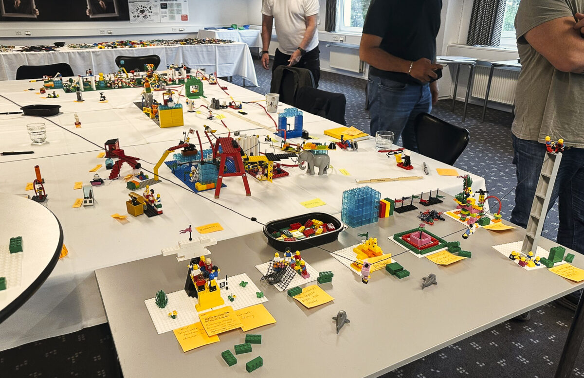LEGO® models labeled with sticky notes showcasing business metaphors during SeriousPlay® workshop.