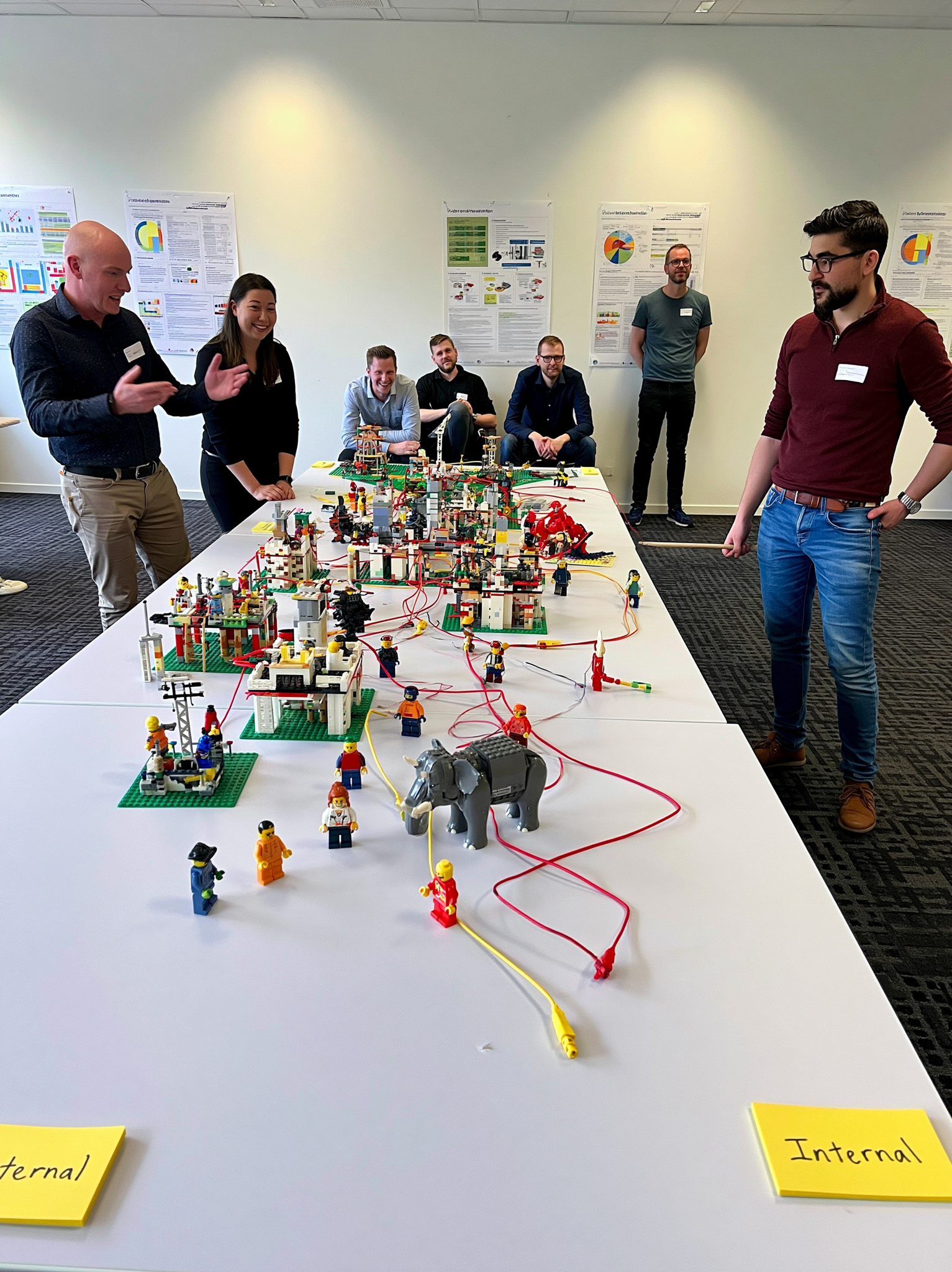 Team presenting a LEGO Serious Play model during a collaborative strategy workshop.